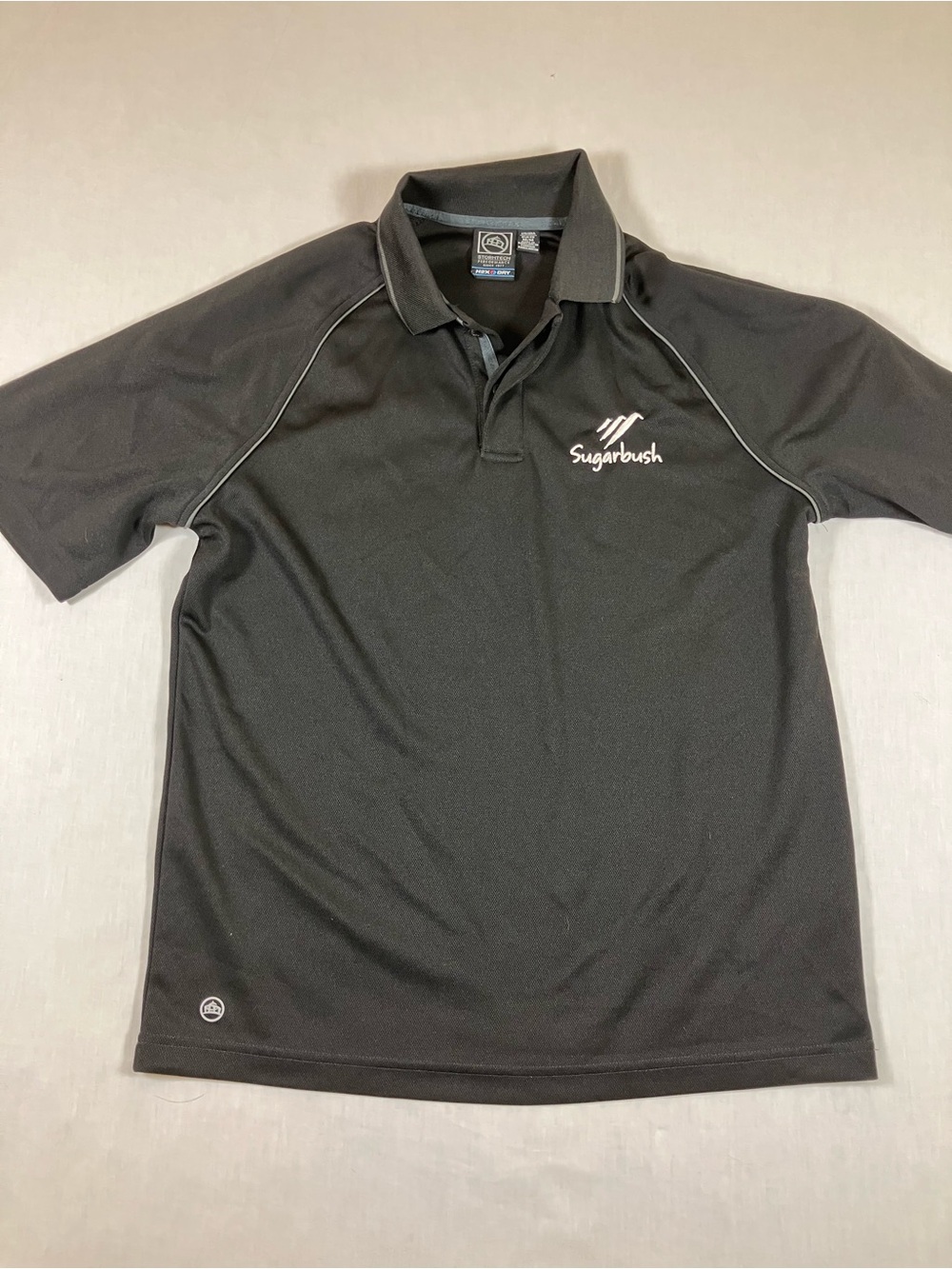 Storm Men’s Black Performance Polo with White Logo